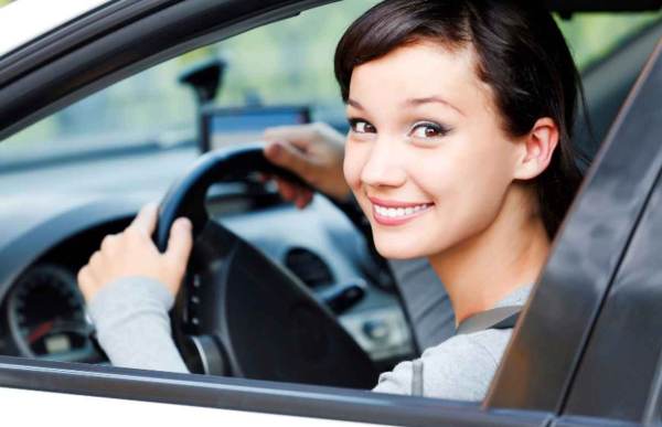Female driver smiling to you