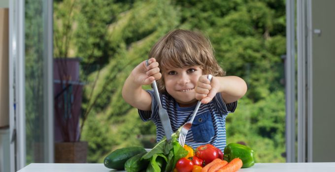 boy eating vegetables