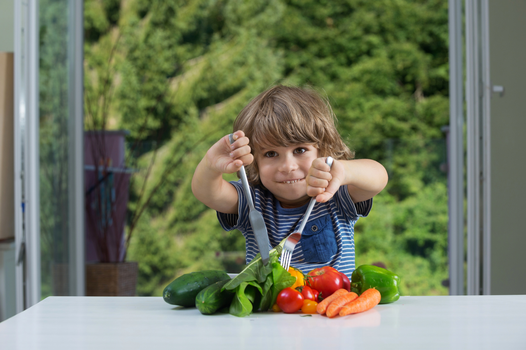 boy eating vegetables