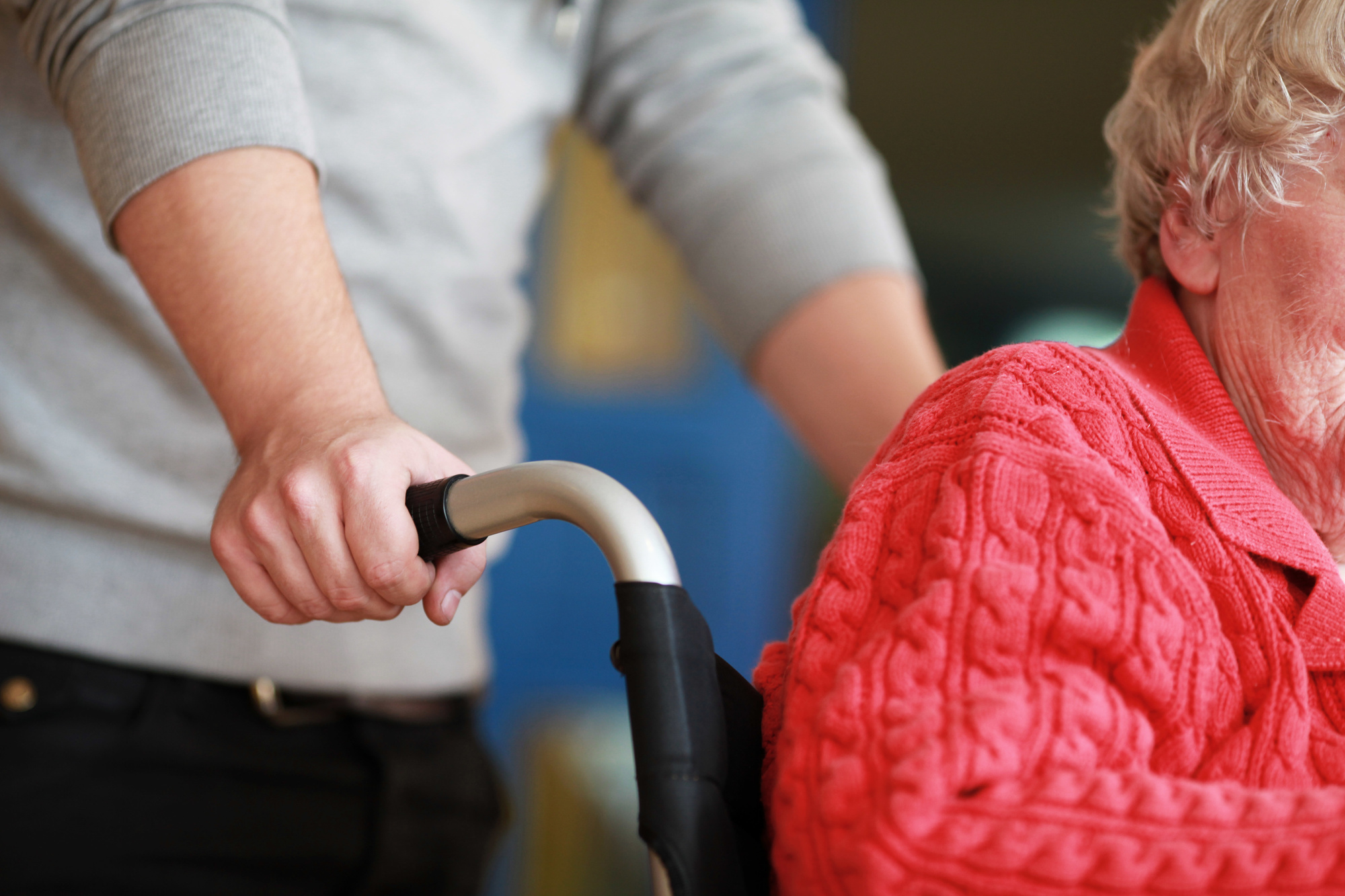 person pushing wheelchair