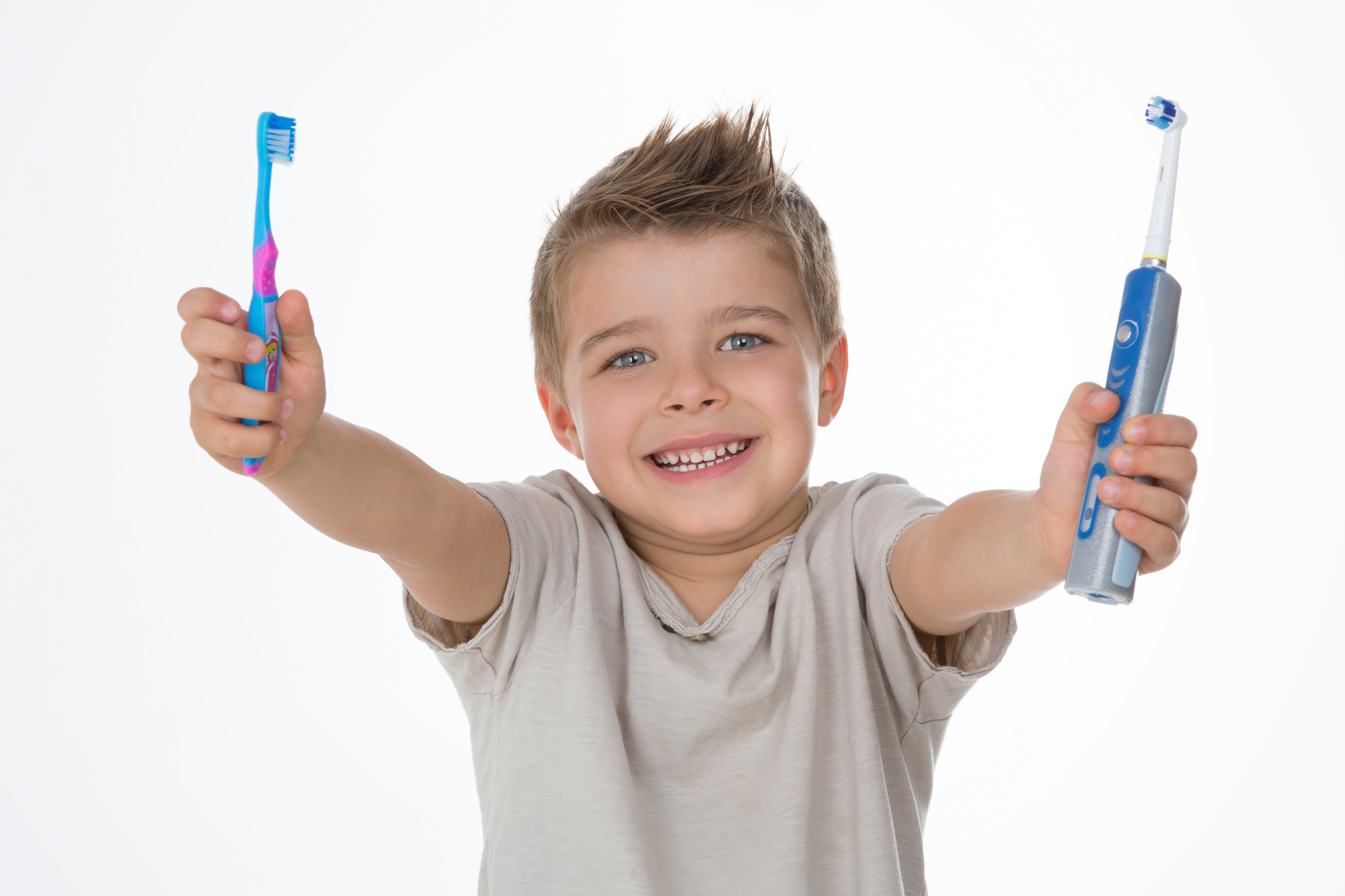 boy with toothbrushes