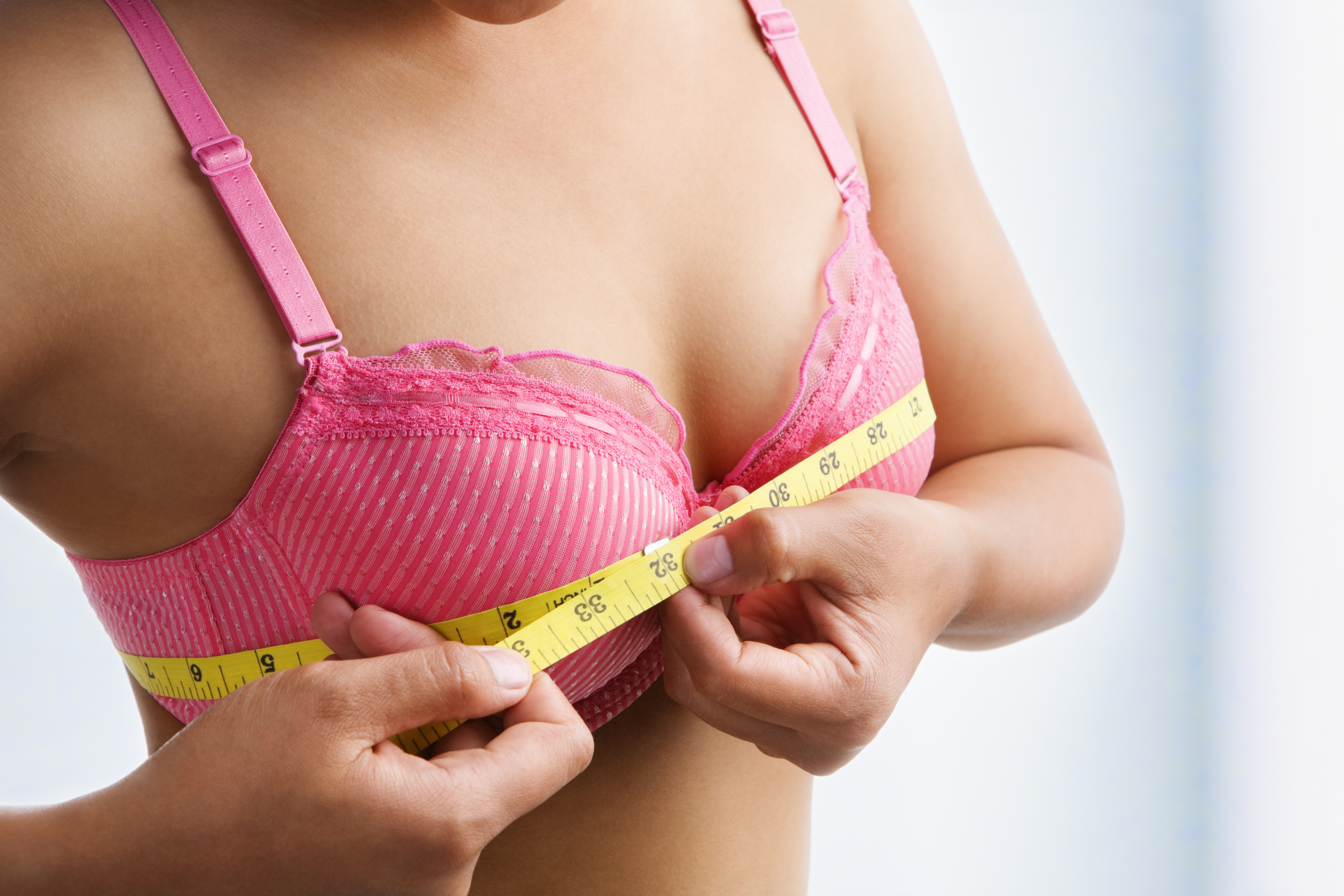 woman measuring for bra