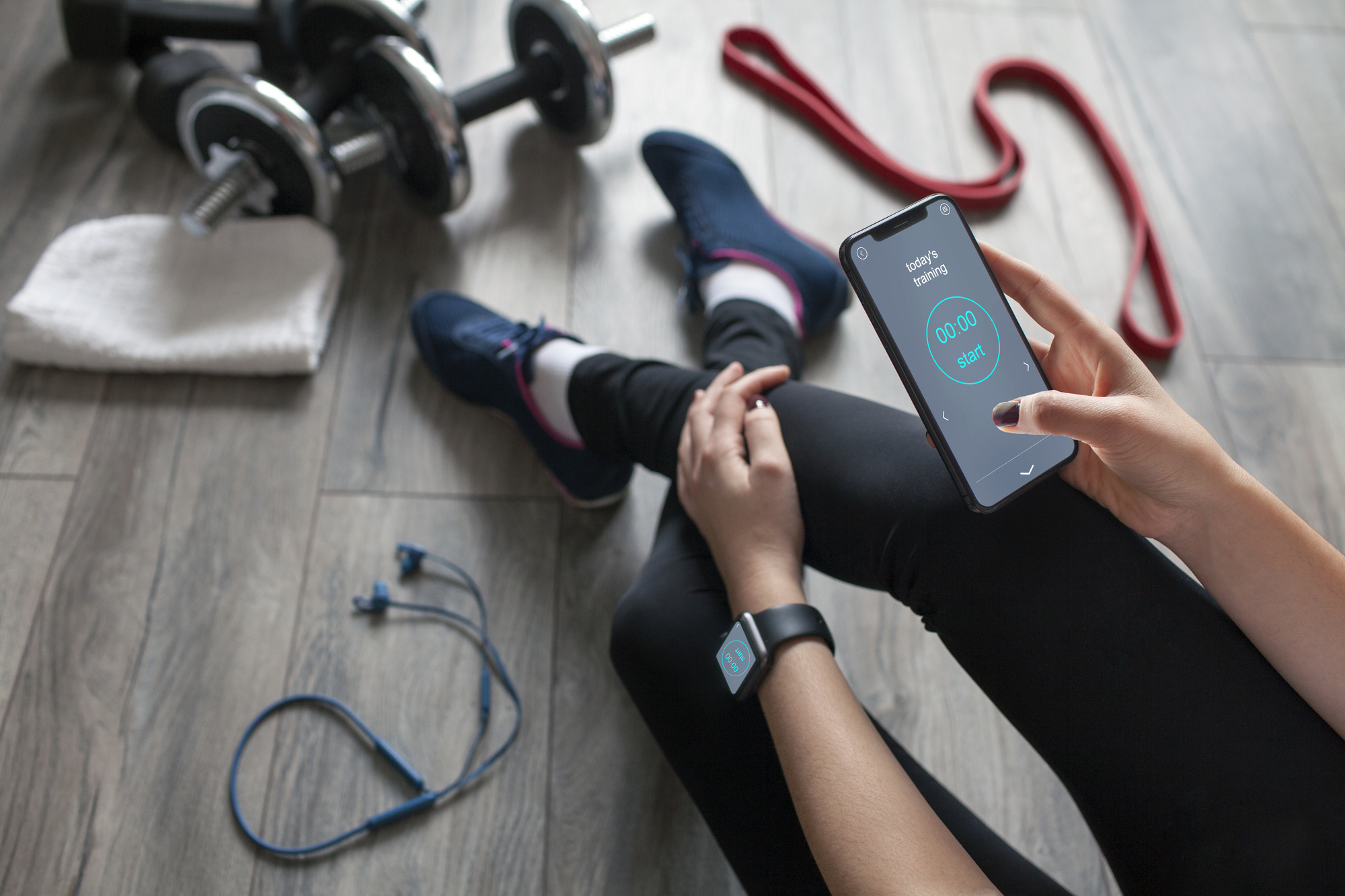 woman looking at workout app