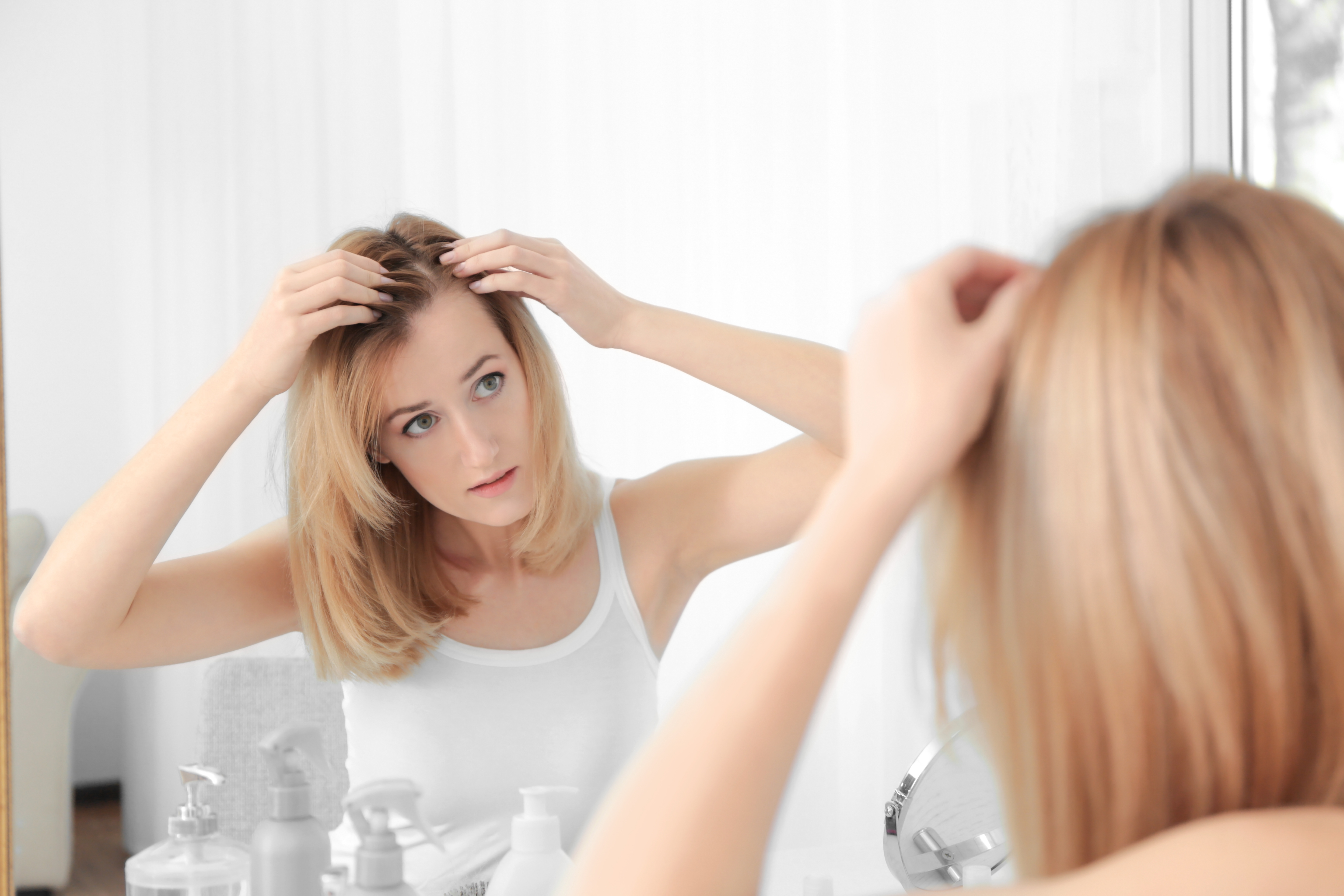 woman checking for hair loss