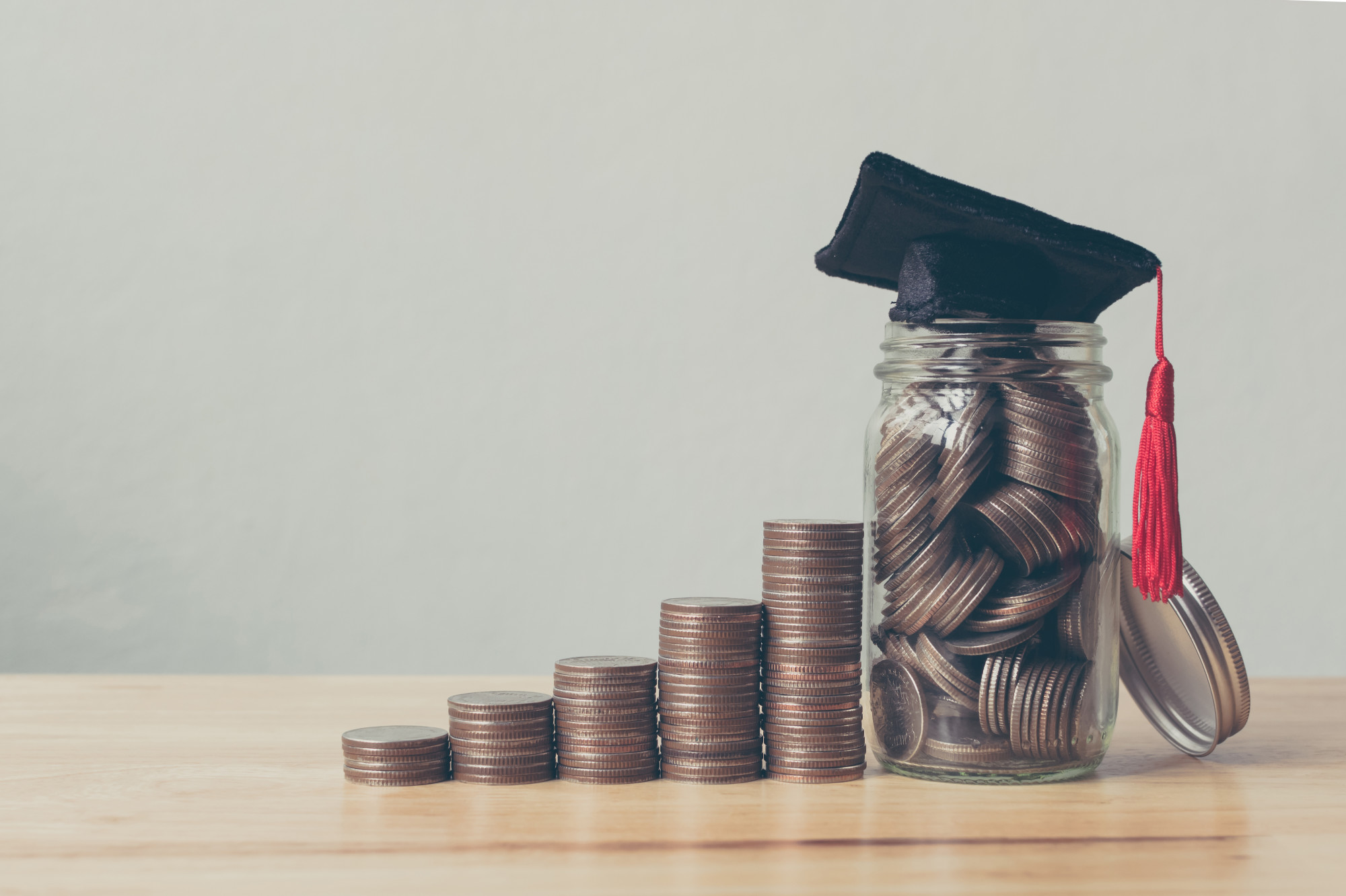 coins and graduation cap