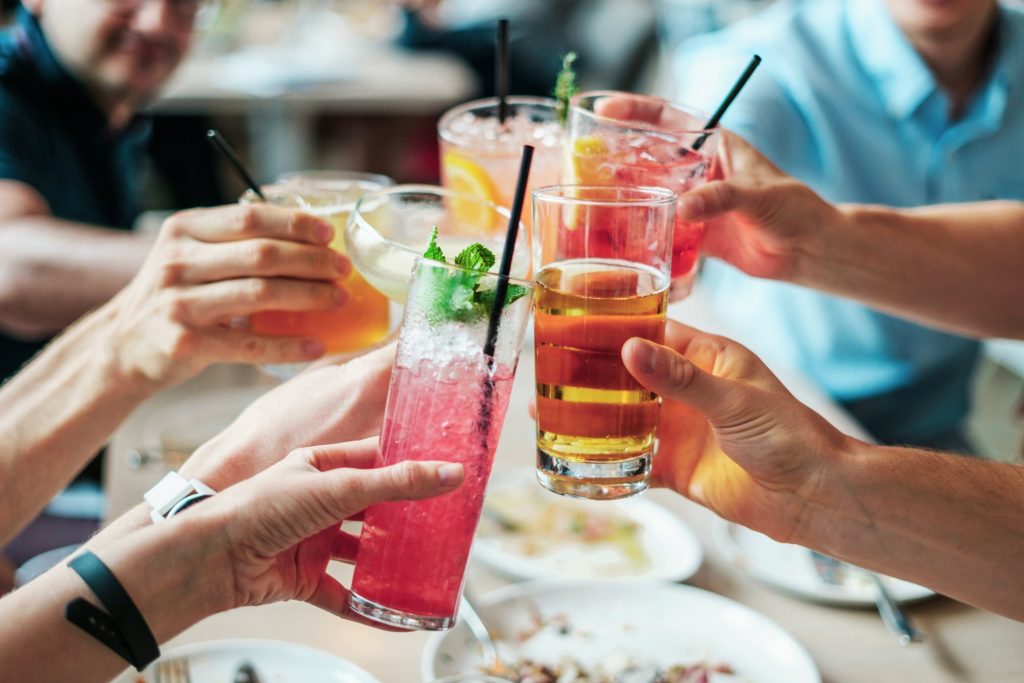 people toasting with alcohol