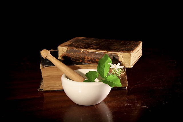 herbs in bowl with books