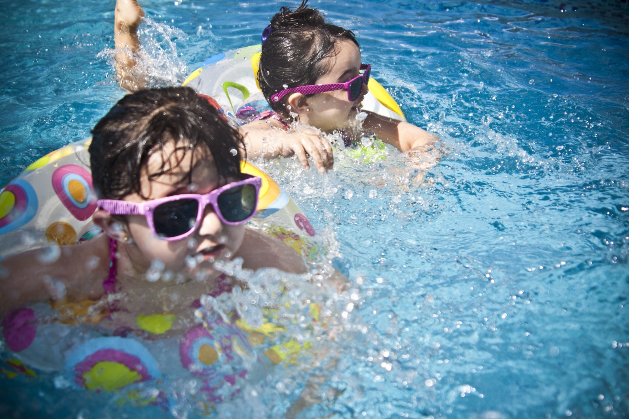 Kids Swimming on a Pool