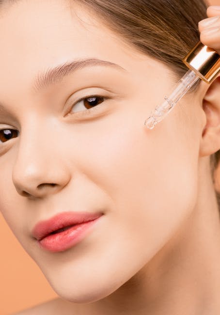 Woman Applying Face Serum