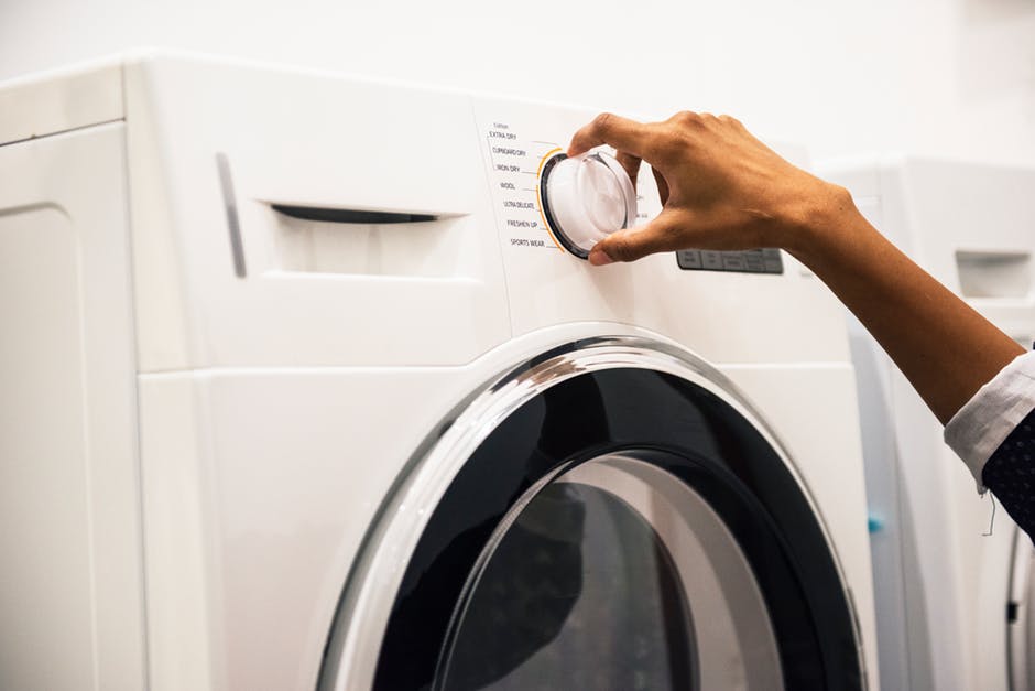 Person Operating a Washing Machine