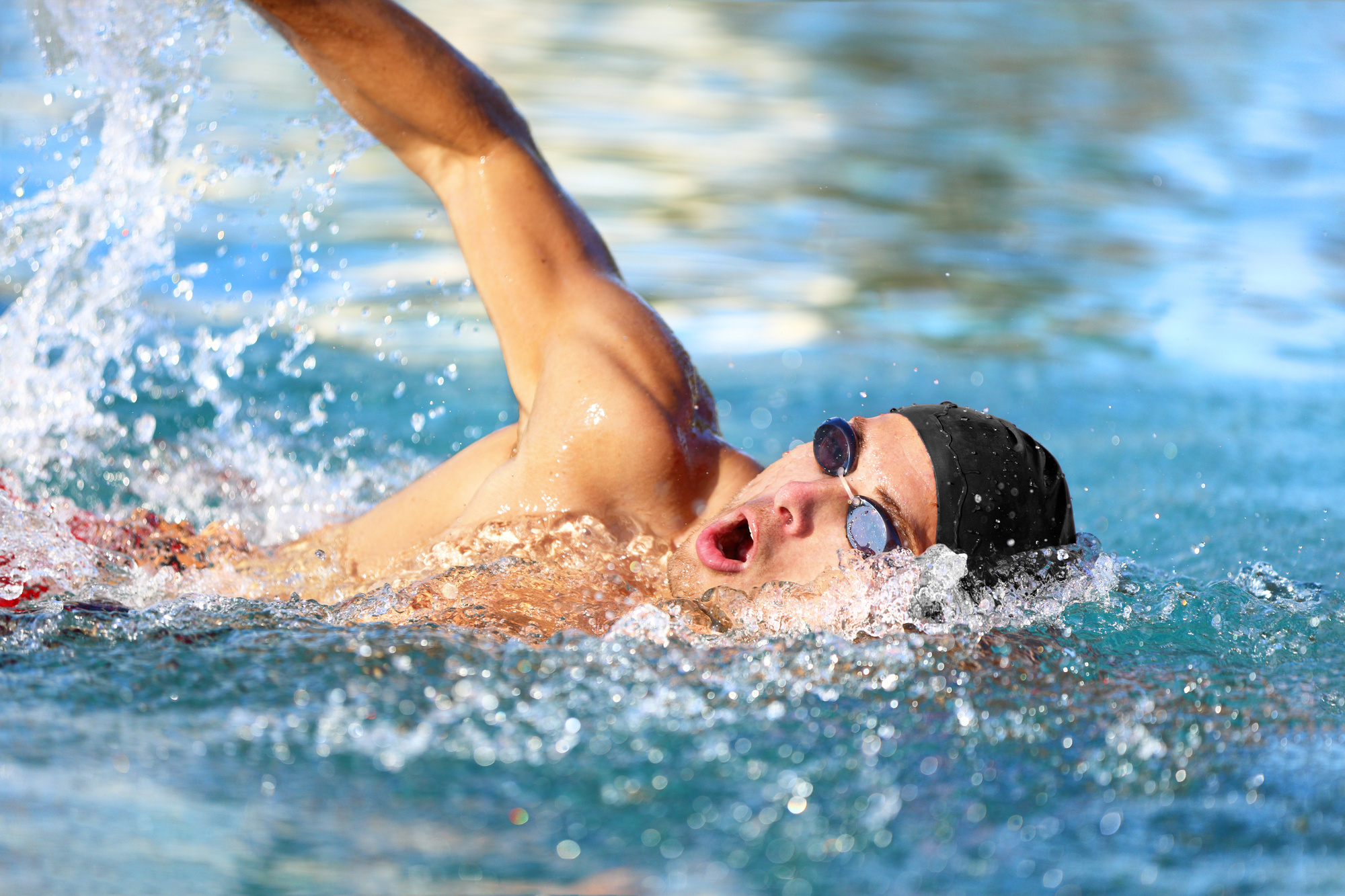 Man Swimming in a Pool