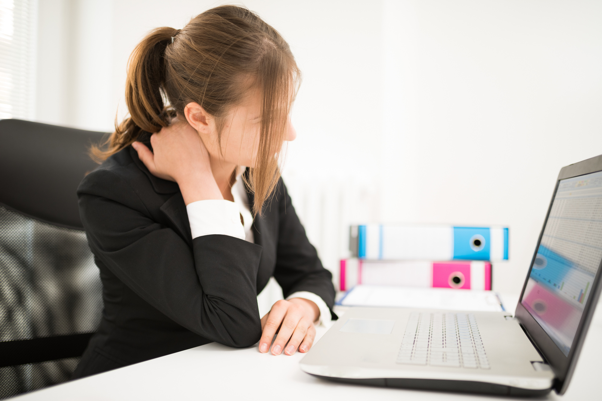 Woman Suffering from Bad Posture at Work