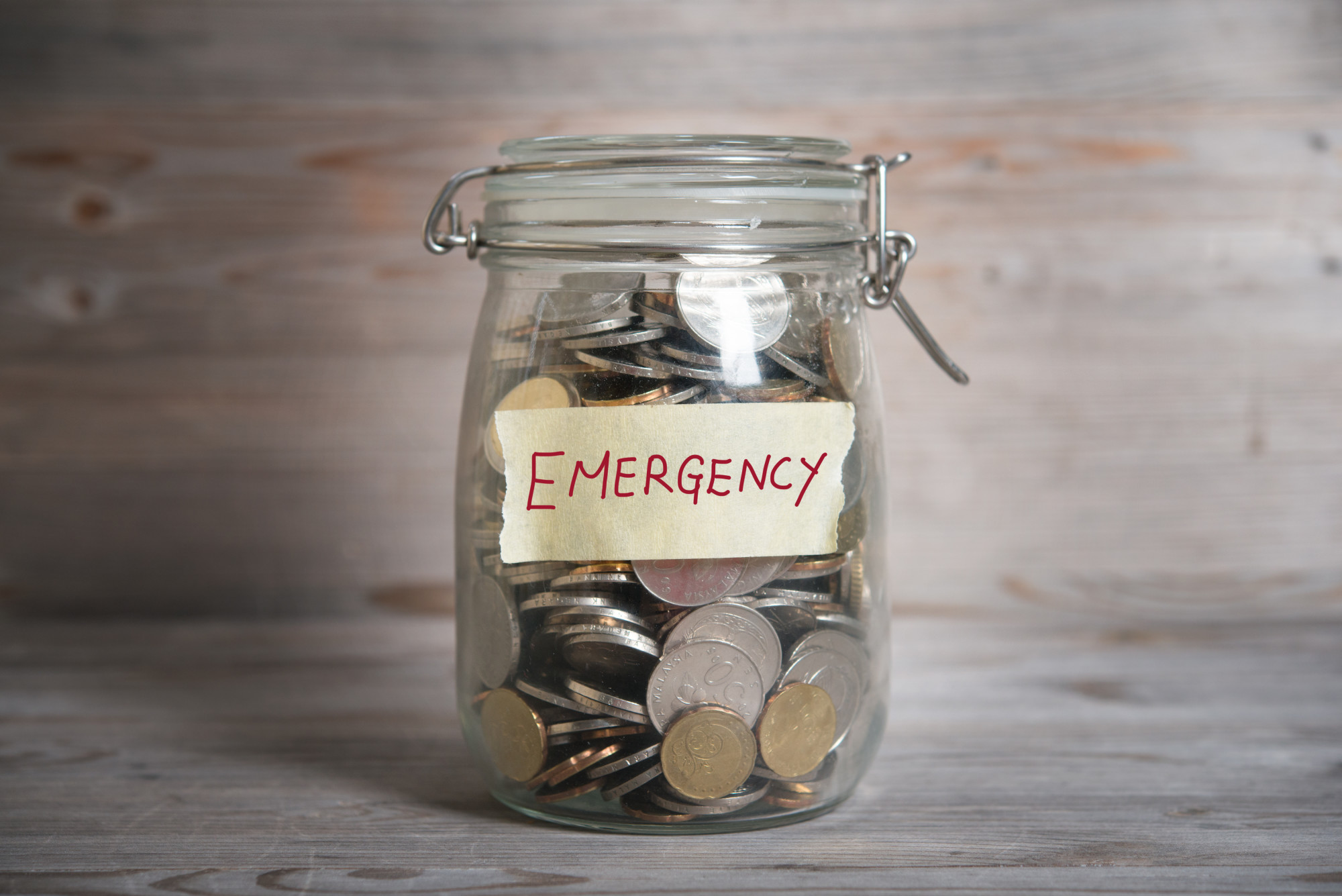 Coins on a Glass Jar as Emergency Fund